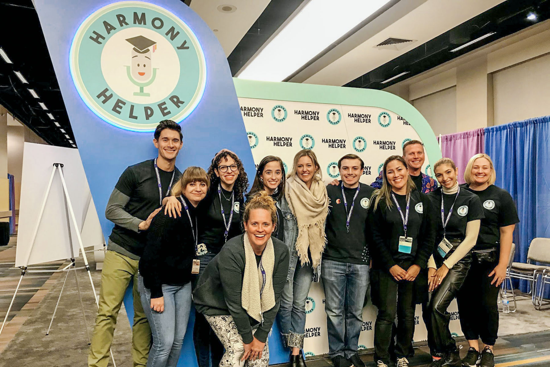 The Harmony Helper team poses in front of their booth at BroadwayCon 2020